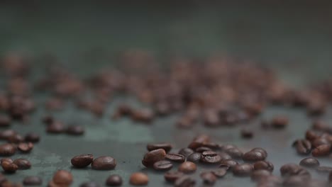 Pull-out-through-the-coffee-beans-on-the-green-background