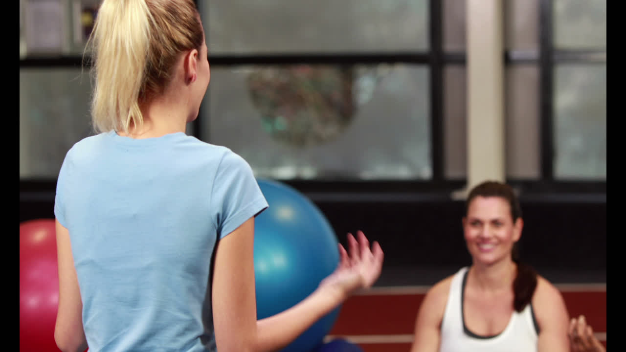 Pregnant women in fitness studio