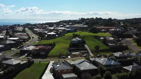 aerial coastal township with housing community and vacant land