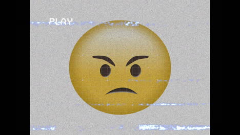 digitale animation des vhs-effekts über wütende gesichtsemoji gegen grauen hintergrund