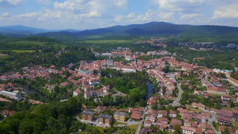 Marvelous-aerial-top-view-flight-mountain-overview-Hill-town-Panorama,-Krumlov-Czech-Republic-Summer-2023