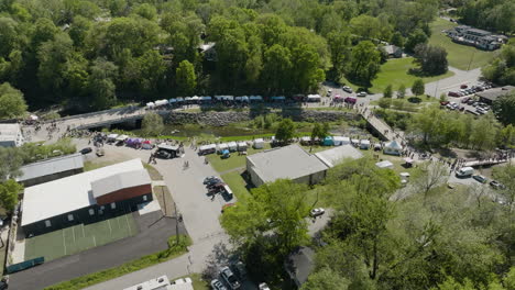 Siloam-Springs-During-Dogwood-Festival-In-AR,-USA---aerial-drone-shot