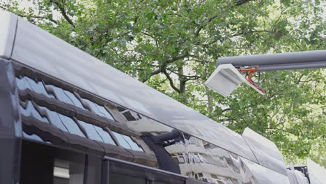 Electric-bus-charging-and-pantograph-starts-moving-down