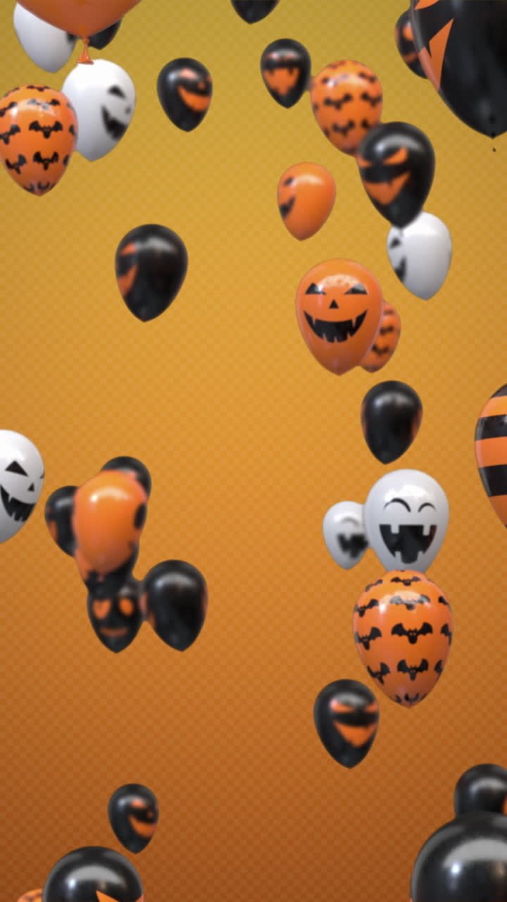 palloncini di halloween volanti su sfondo arancione