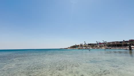 Blue-flag-beach-club-in-Izmir-Cesme-Alacati,-beach-umbrellas,-chairs,-beach-party-in