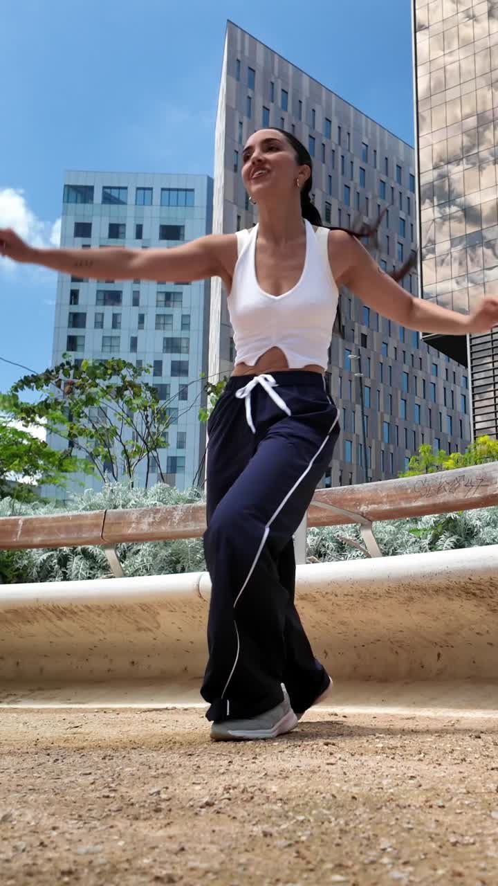 Woman Dancing Outdoors in Urban Setting