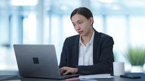 Tired-Indian-female-manager-sleeping-at-work