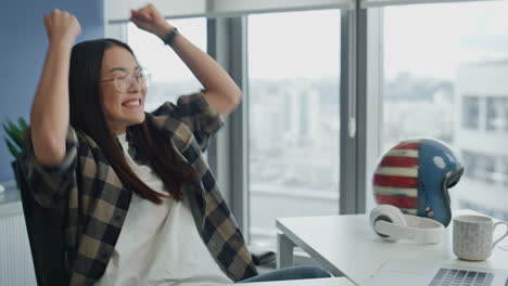 Excited-startuper-rejoicing-laptop-at-office-closeup.-Woman-celebrating-success