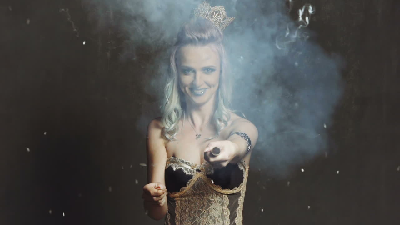 Woman blowing up flapper. Close up of young girl blows up flapper with excited face expressio