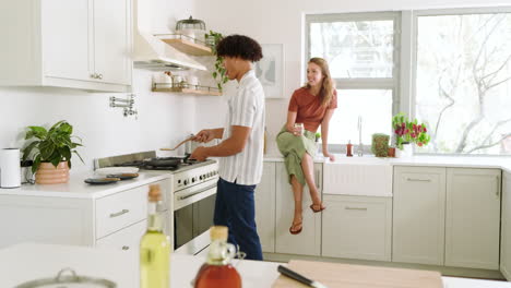 cooking together in kitchen, diverse couple sharing quality time and conversation, at home