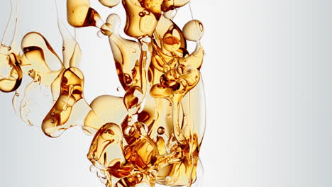 transparent orange gold oil bubbles and fluid shapes in purified water on a white gradient background