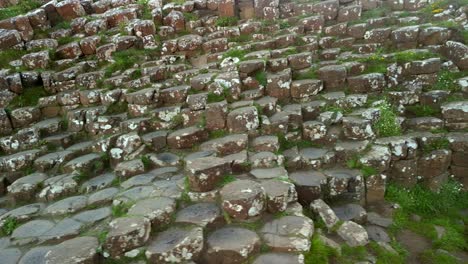 aerial pan from left to right of the basalt stones at giant's causeway, county antrim in northern ireland on a sunny morning