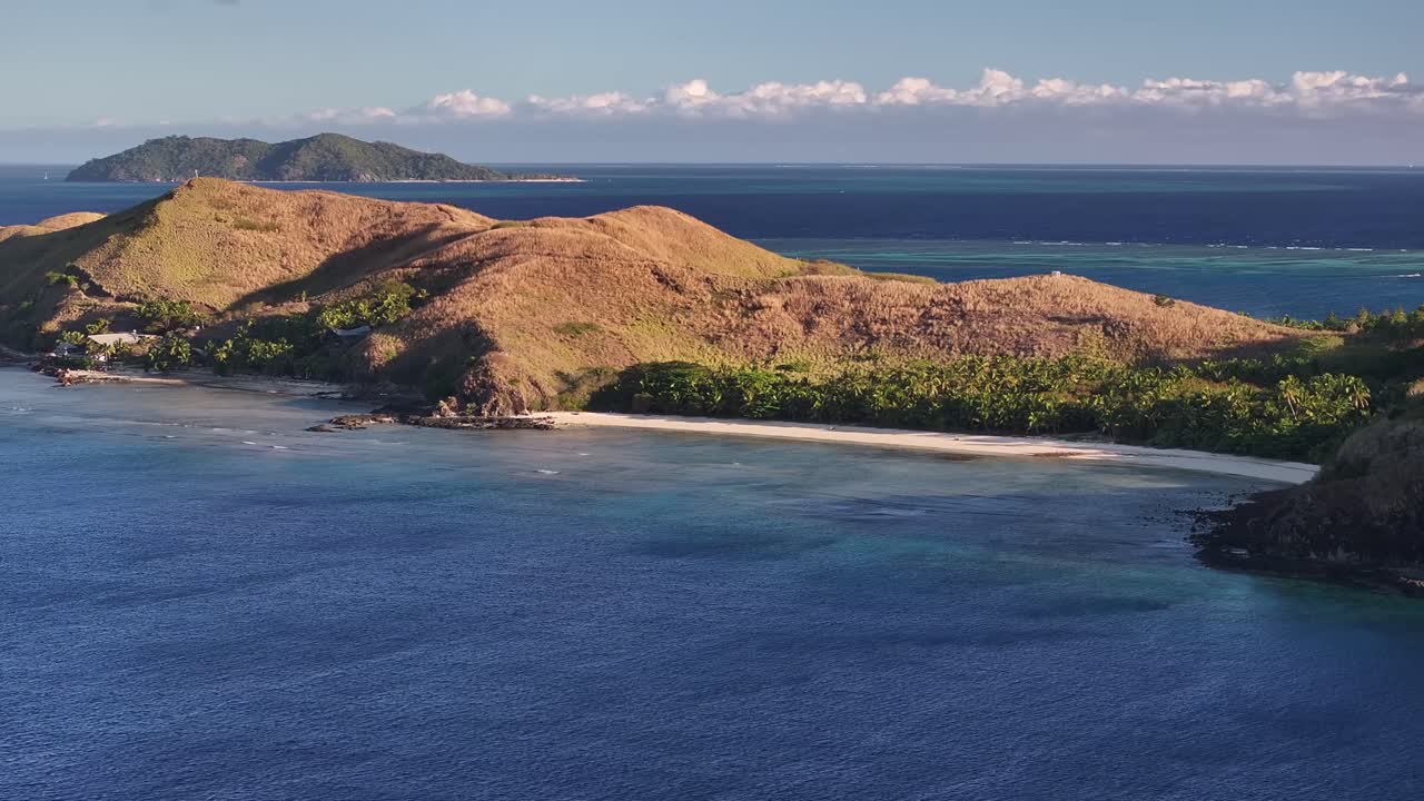 Mana Island Surrounded By Turquoise Seas At Mamanuca Islands, Fiji. Aerial Drone Shot