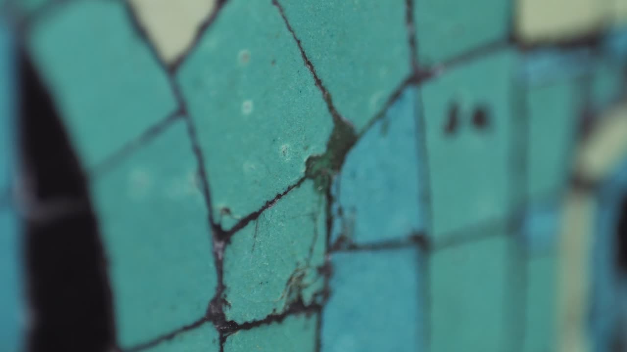 Closeup of mosaic of colored ceramic tile by Antoni Gaudi at his Parc Guell, Barcelona, Spain.