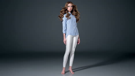 fashion model in striped shirt and white pants