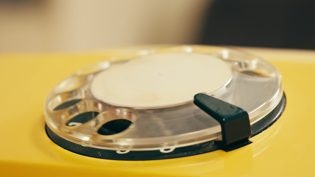 Retro vintage phone, A yellow rotary telephone is displayed on a wooden desk, adding a nostalgic touch
