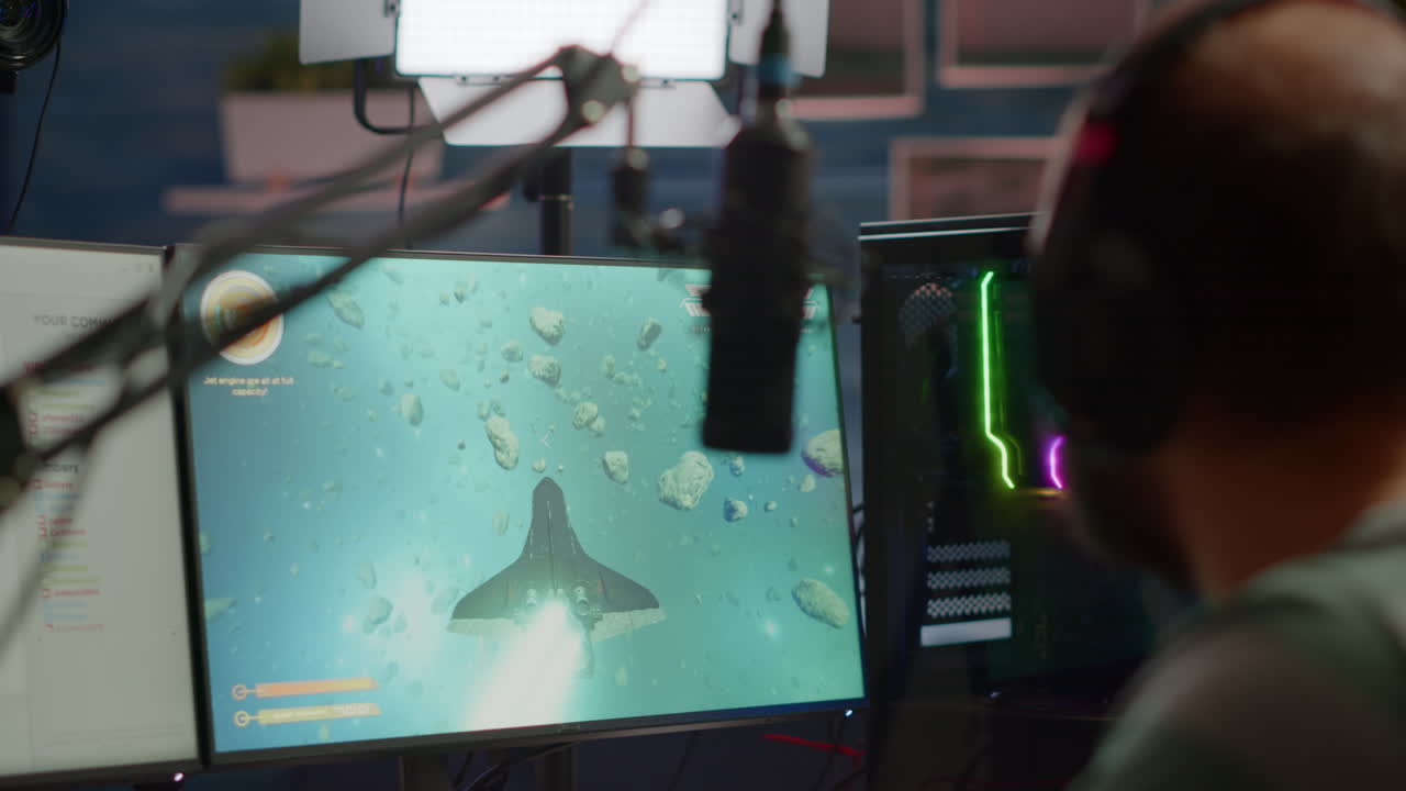 Close-up of streamer man talking at microphone with other players