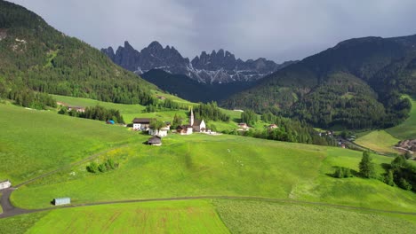 South-Tyrol-aerial-landscape-with-countryside-Santa-Maddalena-Church-and-dramatic-Odle-Mountains