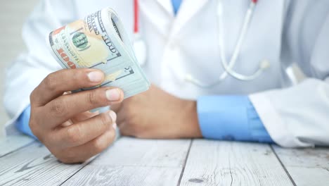 doctor holding money