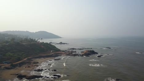 drone shot flying towards the sun and landscape in goa, india