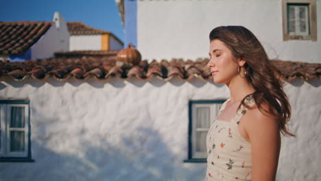 dreamy woman walking sunny village closeup. portrait smiling lady looking camera