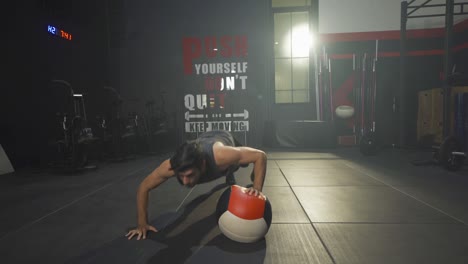 portrait of middle east man using a training ball. muscle strength training workout at gym fitness center club. exercise indoor with sport equipment. athletic. people lifestyle.