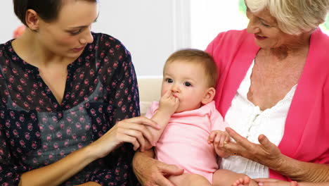 Happy-family-looking-the-baby