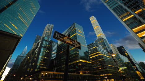 New-York-park-avenue-Plaza,-financial-district,-cityscape,-buildings,-skyscrapers,-skyline,-sunset,-clouds,-timelapse-sky-replacement,-one-way-sign