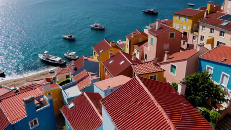 colorful coastal village with boats and seagulls