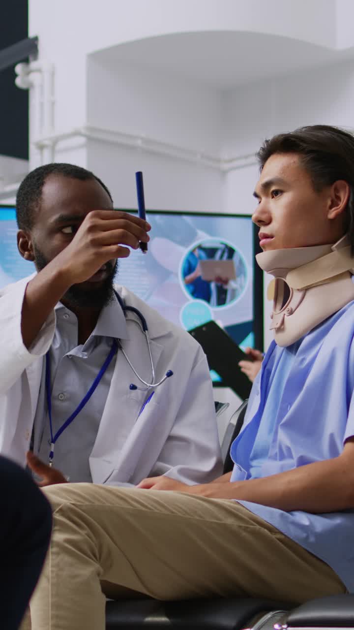 Vertical video: Physician checking patient vision