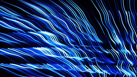 abstract 3d loop background with blue glow particles lined up in rows along lines in 3d space. festive vj loop with multicolored particles and smooth animated camera. motion design background.