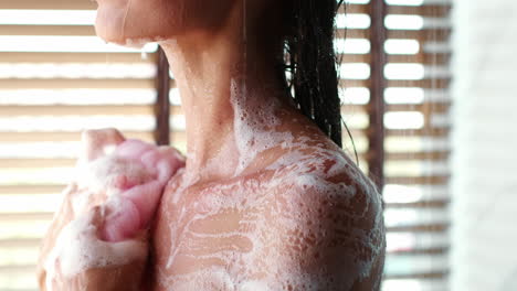 woman washing herself in the shower