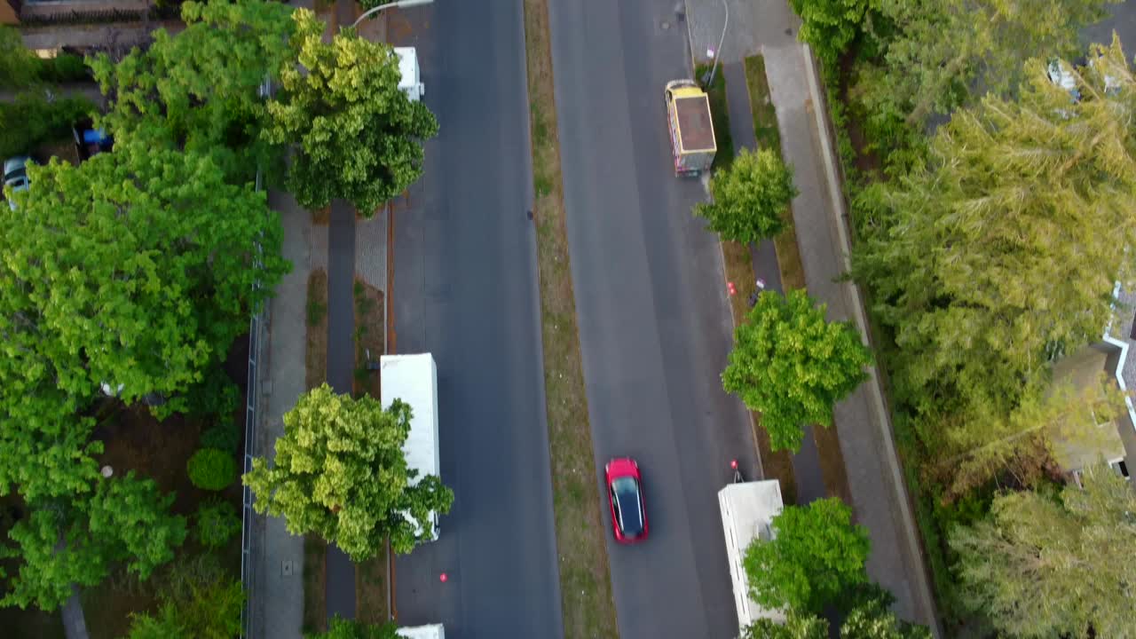 Cars drive on an avenue