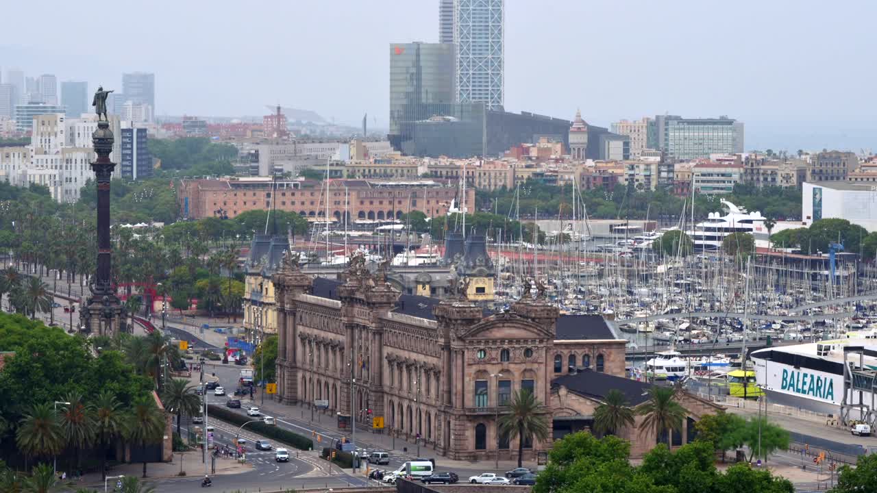 Aerial drone view of the Port Vell, the Columbus Monument and the Junta d'Obres del Port building in Barcelona, Spain