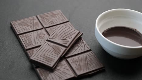 Dark-chocolate-cream-and-candy-bar-on-table