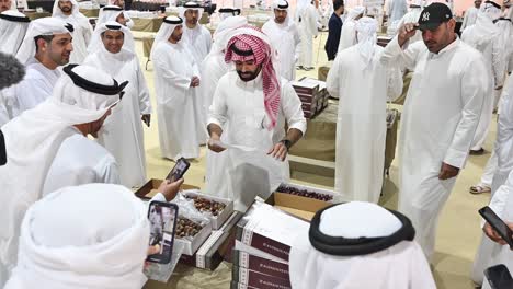 local emiratis gathered during the dates auction at the al dhaid dates festival 2024 in sharjah