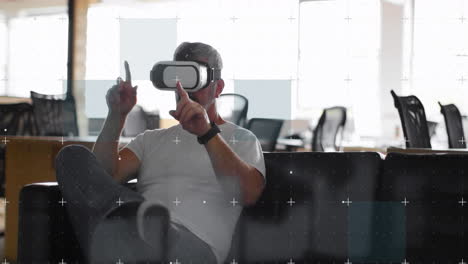 white particles moving over grid network against caucasian man gesturing while wearing vr headset
