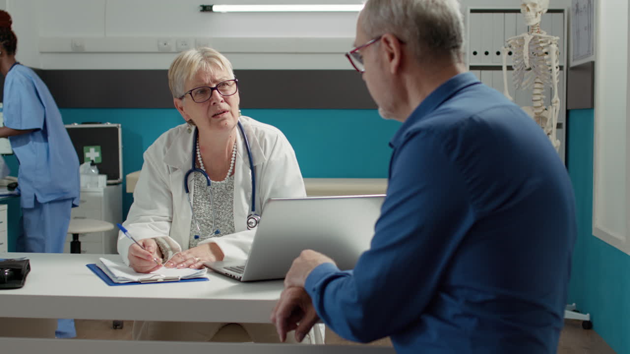 Health specialist taking notes at checkup examination