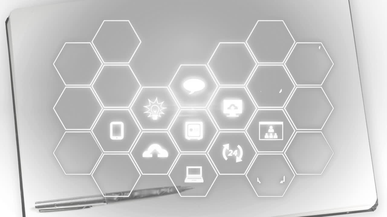 Animation of network of digital icons over pen and notebook in background