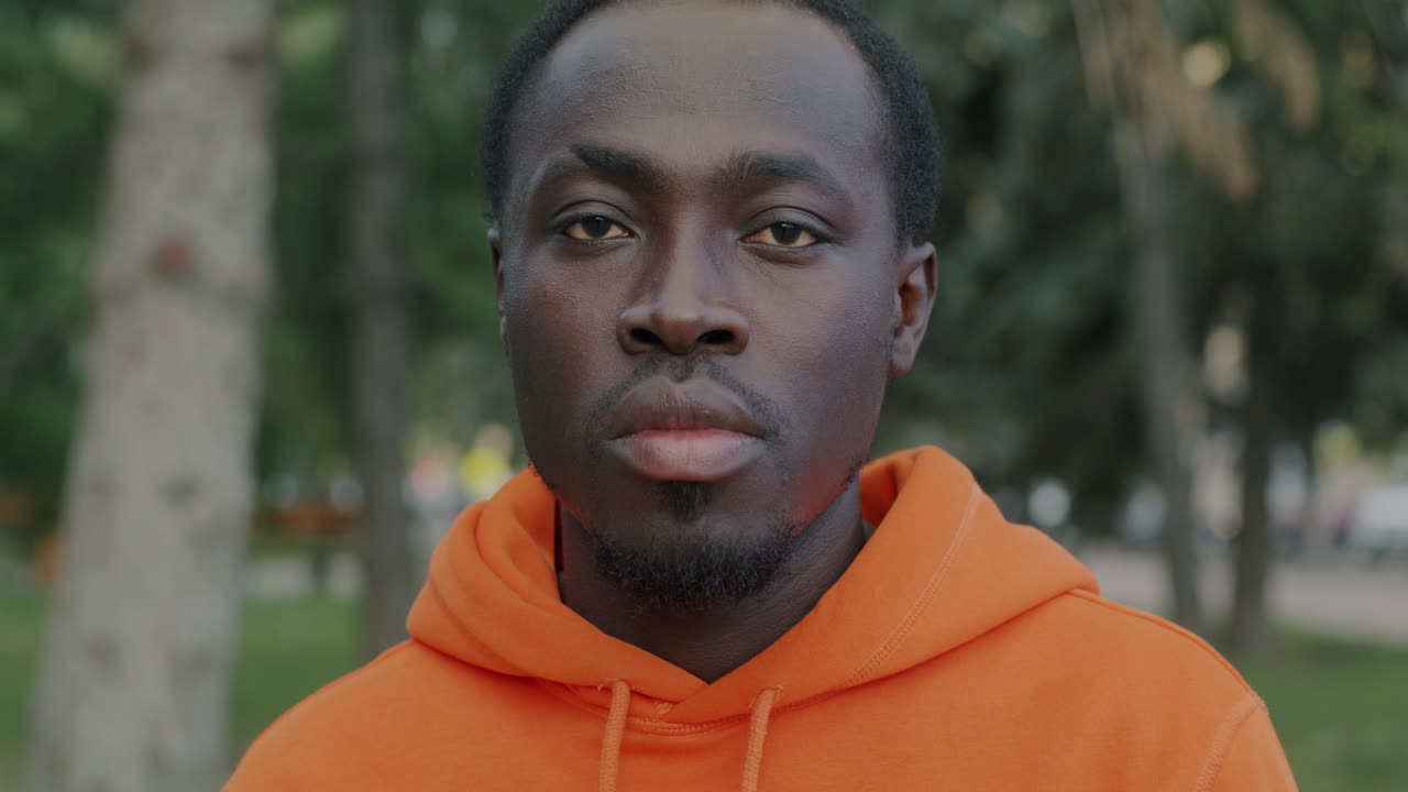 Man in Orange Hoodie