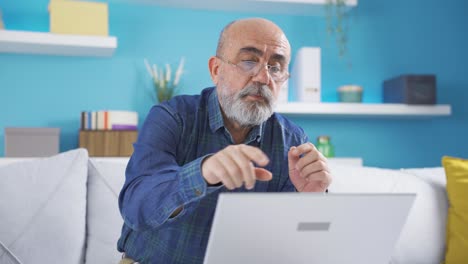 Retired-businessman-talking-at-facetime-meeting-from-home.