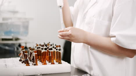 scientist working with vials in a laboratory