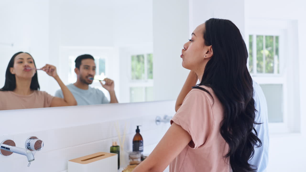 Brushing teeth, happy couple