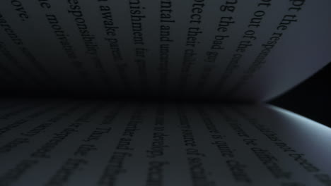 Open-book-with-white-pages.-Camera-moving-between-book-pages-of-open-book.