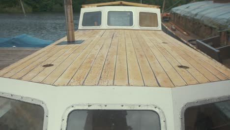 sanded roof planks of wooden boat tilt up reveal