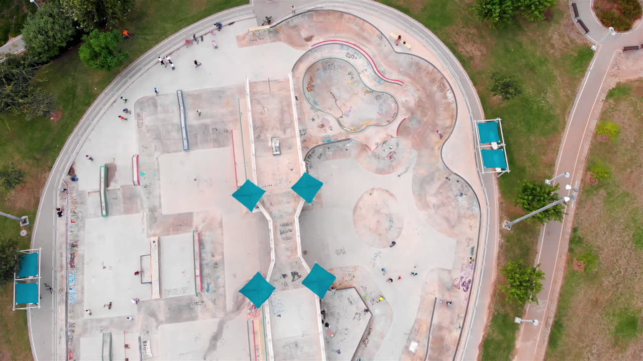Drone footage Above Skatepark with People Skating