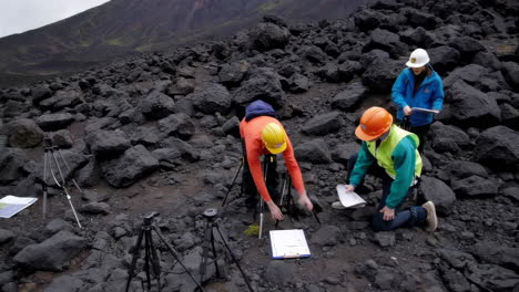 geologists studying volcanic terrain