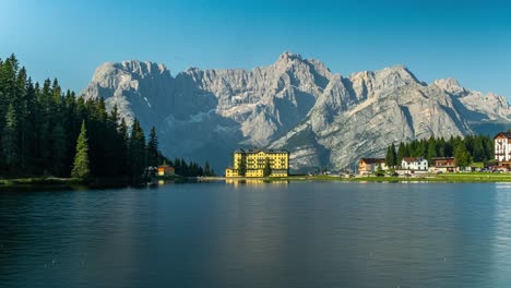 timelapse of lake misurina in the dolomites, italy with the misurina hospital in the background in summer