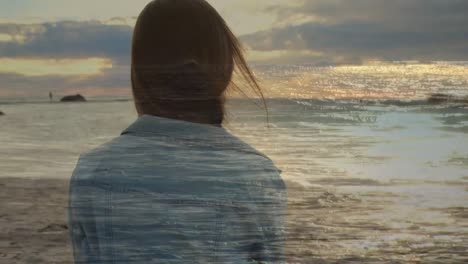 Woman-sitting-by-the-beach