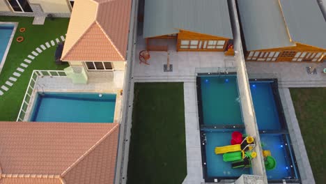 aerial rising tilt up shot of newly built house revealing construction site